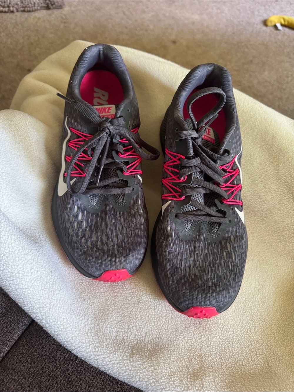 Nike Women's Dark Gray Running Sneakers with Hot Pink Accents